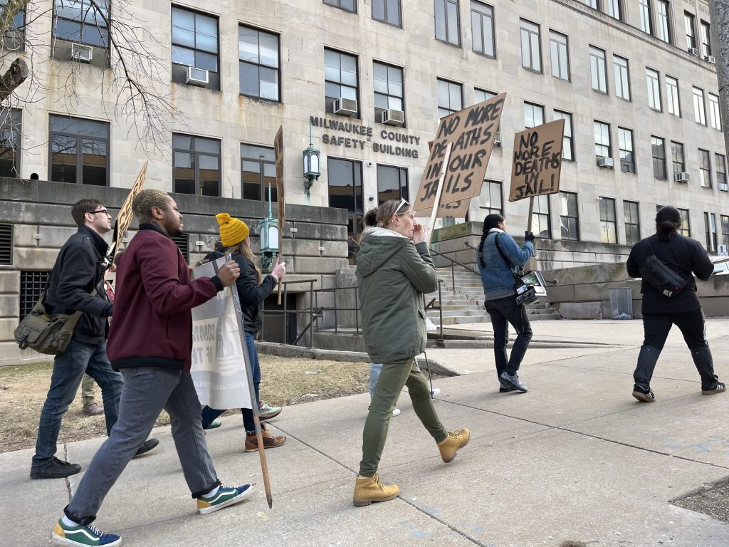 Activists and community members picket outside the Milwaukee County Jail in March 2023 to raise awareness about conditions at the facility. (Photo by Devin Blake)