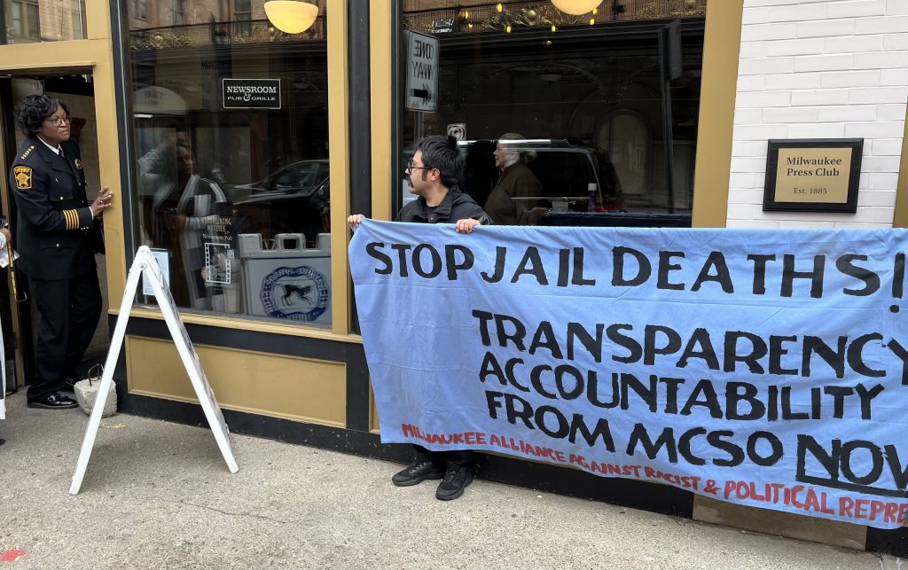 Jail safety advocate Omar Flores confronts Milwaukee County Sheriff Denita Ball outside an event at the Milwaukee Press Club in April 2023. Flores and other organizers with the Milwaukee Alliance Against Racist and Political Repression have pushed for greater transparency following deaths at the Milwaukee County Jail. (Photo by Devin Blake)
