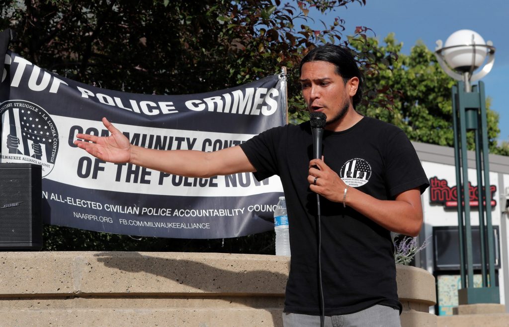 Alan Chavoya, treasurer and organizer with the Milwaukee Alliance Against Racist and Political Repression, speaks at a rally in Milwaukee in 2023. (Pat A. Robinson for Wisconsin Watch)