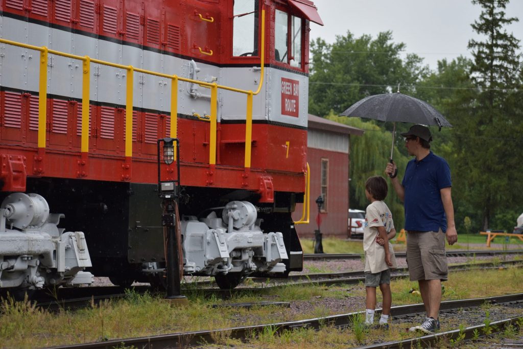 A boy and his dad look at one of the locomotives at the Mid-Continent Railway Musem near Baraboo, WI. Avery Martinez/WPR
