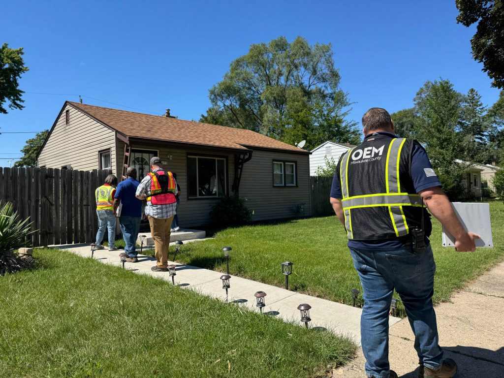 Staff with FEMA are seen here assessing storm damage in Milwaukee on Thursday, Aug. 21, 2025. Evan Casey/WPR