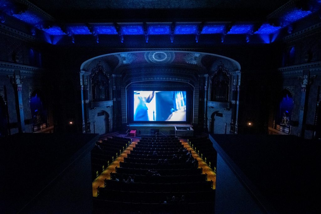 People watch a movie at the Oriental Theatre on Friday, Sept. 22, 2023, in Milwaukee, Wis. Angela Major/WPR