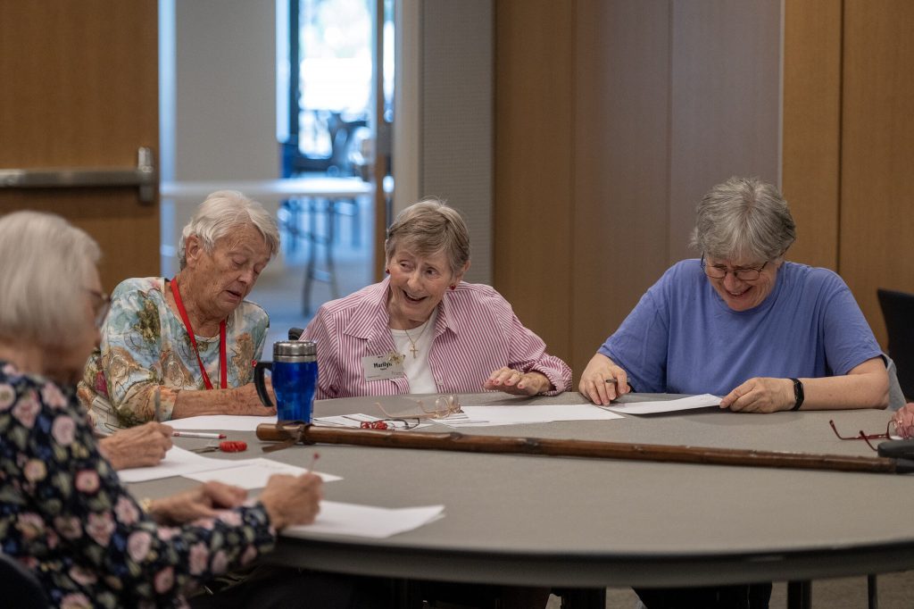 Retirement home residents participate in a brain game led by Marquette University PhD student Daija Holliday on Saturday, Aug. 22, 2026, at St. Camillus in Milwaukee, Wis. Angela Major/WPR