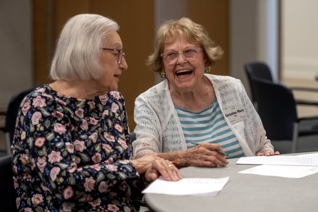 Residents laugh as they participate in a brain game activity led by Marquette University PhD student Daija Holliday on Saturday, Aug. 22, 2026, at St. Camillus in Milwaukee, Wis. Angela Major/WPR