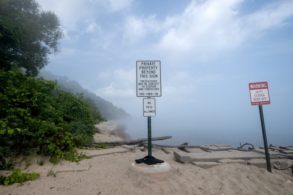 A sign alerts beachgoers to a private property line Tuesday, Sept. 1, 2026, along the shore of Lake Michigan at Atwater Beach in Milwaukee, Wis. Angela Major/WPR