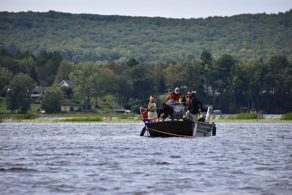 Diving crews work the lines pulling the plane. Avery Martinez/WPR