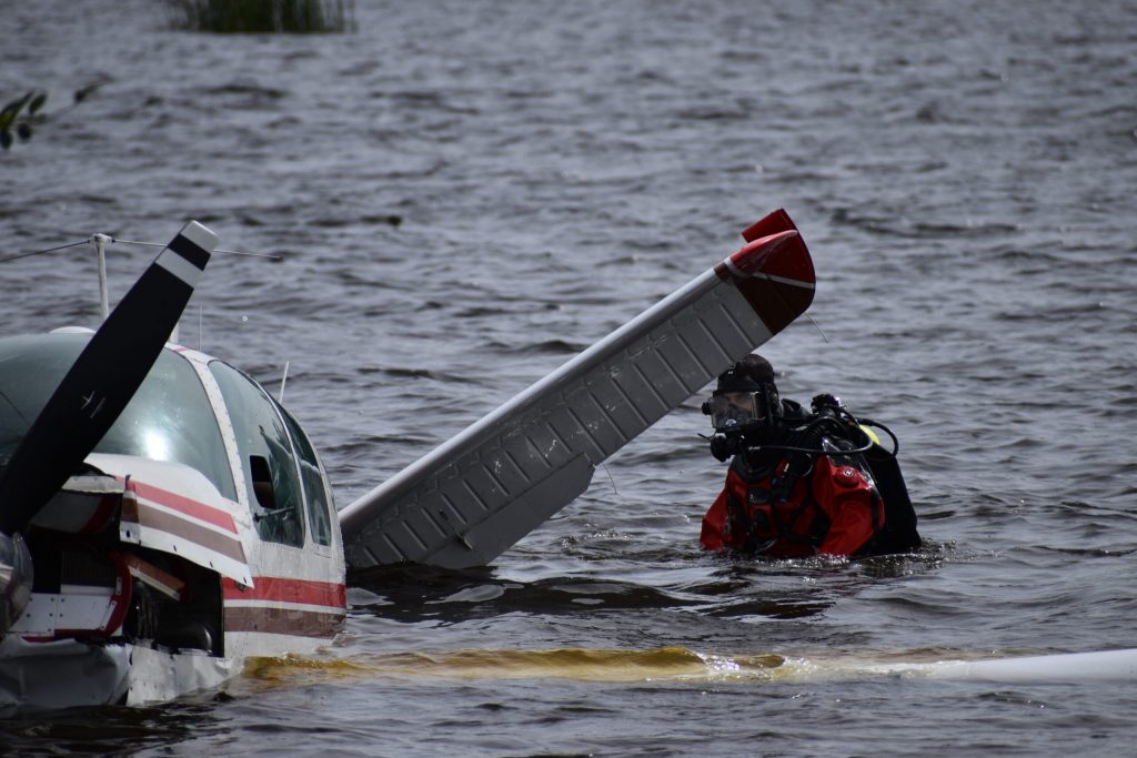 A diver carefully navigates around still submerged parts of the plane. Avery Martinez/WPR