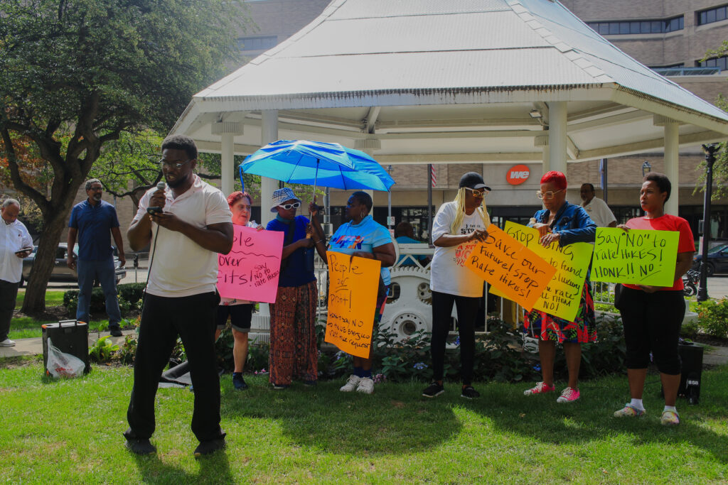 Yusuf Adama of Walnut Way speaks against We Energies' proposed rate increase at a rally in Milwaukee Sept. 1, 2026. (Henry Redman | Wisconsin Examiner)