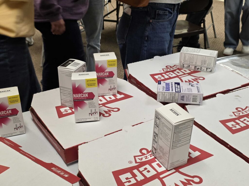 Narcan was handed out by Andrew Garr during a meeting of the Good Samaritan Coalition in Eau Claire. Garr encourage all the participants to carry Narcan to save a life. (Frank Zufall/Wisconsin Examiner)