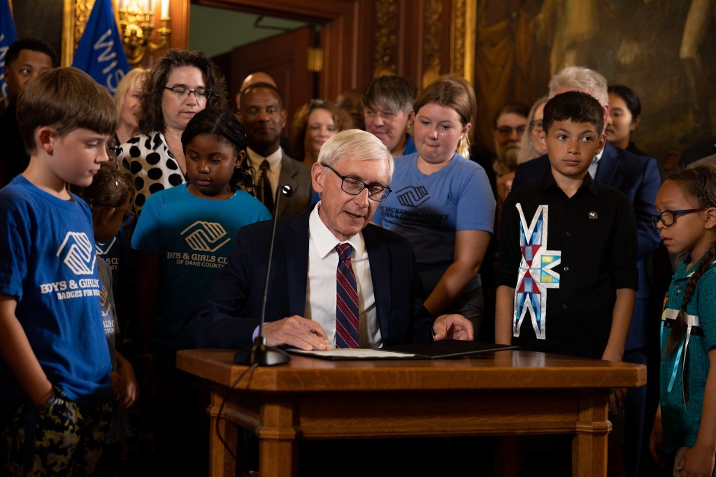 Gov. Tony Evers is photographed signing the Wisconsin 2023-25 biennial budget on July 5, 2023, in the Wisconsin State Capitol building in Madison, Wis. (Drake White-Bergey / Wisconsin Watch)