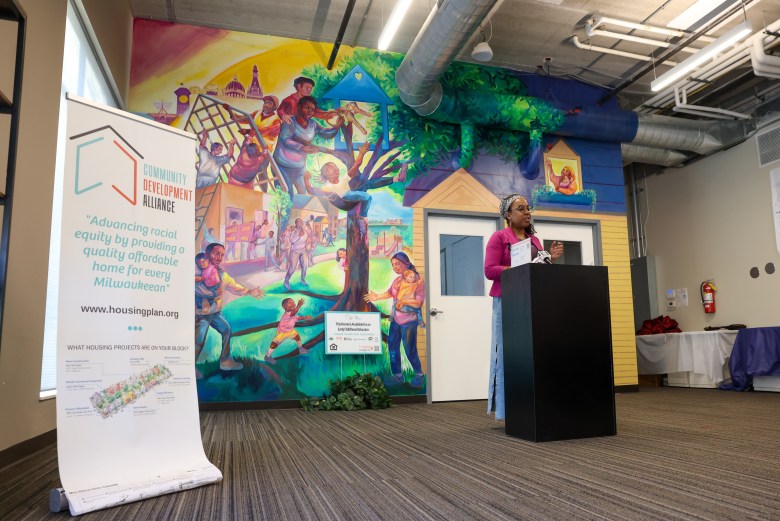 Republicans are supporting a constitutional amendment on the November ballot that would end government programs with preferential treatment by race. In this photo, Tia Richardson speaks in front of the mural she painted during a mural unveiling at the Community Development Alliance on Feb. 18, 2026, in Milwaukee. (Jonathan Aguilar / Milwaukee Neighborhood News Service / CatchLight Local)
