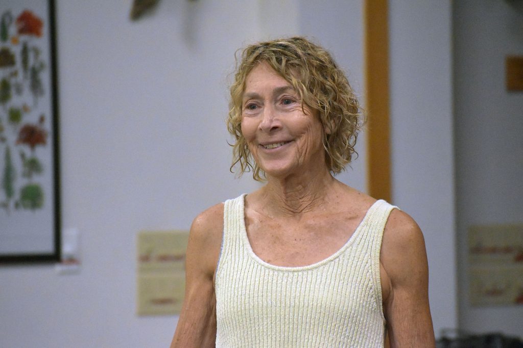 Cindy Conlon, a certified forest therapy guide, introduces a group to the history behind the Japanese wellness practice of forest bathing at the Trees for Tomorrow campus in Eagle River, Wis. on Aug. 8, 2026. Danielle Kaeding/WPR