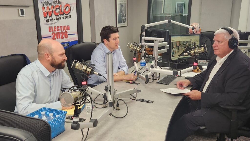 1st Congressional District Democratic candidate Mitchell Berman, left, and Republican incumbent Bryan Steil, center, debate Tuesday at radio station WCLO in Janesville, responding to questions posed by WCLO's Tim Bremel, right. (Photo by Erik Gunn/Wisconsin Examiner)