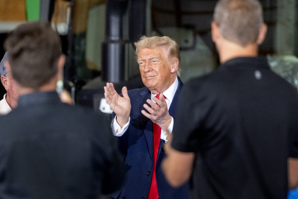 President Donald Trump claps as he arrives at a roundtable event Friday, June 5, 2026, in Chippewa Falls, Wis. Angela Major/WPR