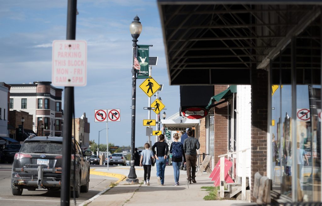 Pedestrians walk through downtown Viroqua, Wis., on Tuesday, Oct. 6, 2026. Angela Major/WPR