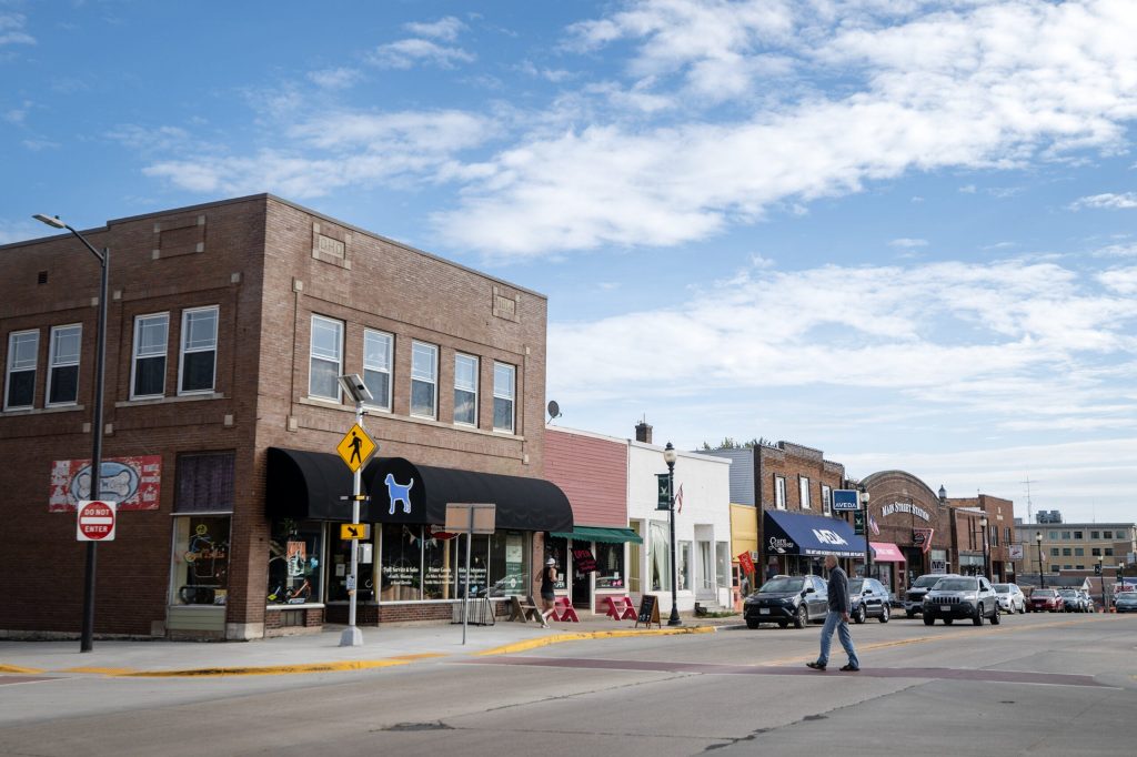 A pedestrian walks through downtown Viroqua, Wis., on Tuesday, Oct. 6, 2026. Angela Major/WPR