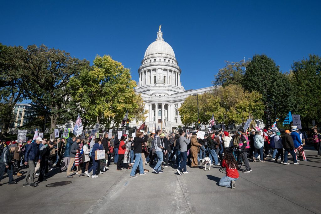 No Kings protesters march near the Wisconsin State Capitol to encourage people to vote early and to elect Democrats in the upcoming midterm election Saturday, Oct. 17, 2026, in Madison, Wis. Angela Major/WPR