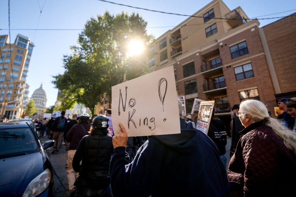 Protesters who oppose President Trump make their way to the Wisconsin State Capitol on Saturday, Oct. 17, 2026, during a No Kings protest in Madison, Wis. Angela Major/WPR