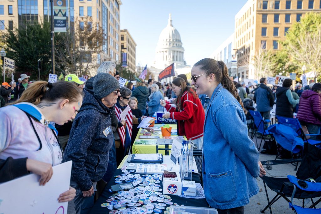 Information on early voting and the upcoming midterm election is shared during the Vote Early Fair on Saturday, Oct. 17, 2026, outside the Madison Municipal building in Madison, Wis. Angela Major/WPR