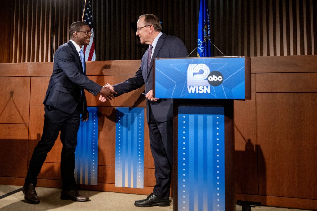 Wisconsin gubernatorial candidates Milwaukee County Executive David Crowley, left, and U.S. Rep. Tom Tiffany, right, shake hands before debating Wednesday, Oct. 21, 2026, at Marquette University Law School’s Eckstein Hall in Milwaukee, Wis. Angela Major/WPR