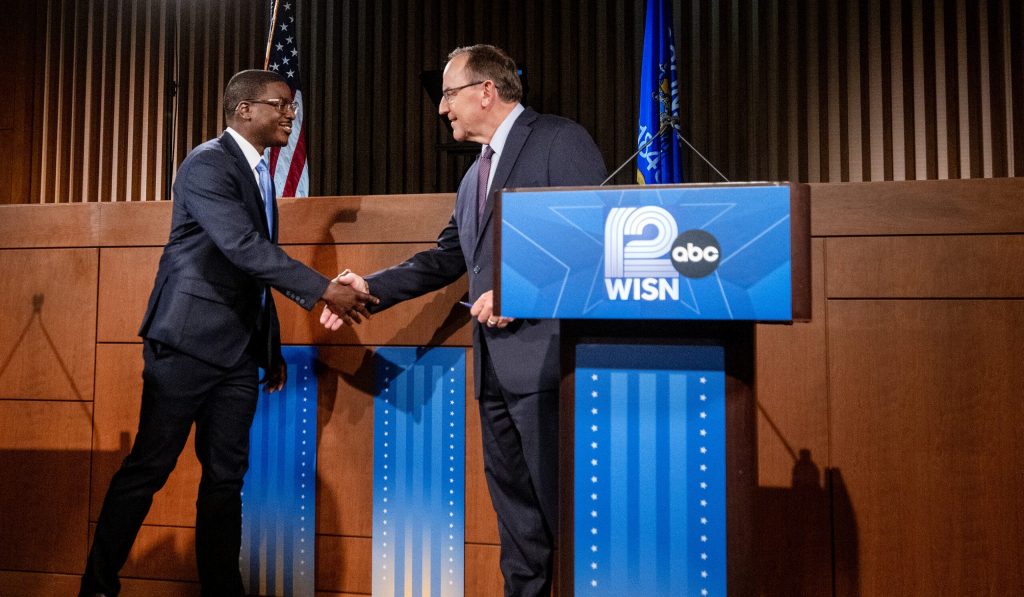 Wisconsin gubernatorial candidates Milwaukee County Executive David Crowley, left, and U.S. Rep. Tom Tiffany, right, shake hands before debating Wednesday, Oct. 21, 2026, at Marquette University Law School’s Eckstein Hall in Milwaukee, Wis. Angela Major/WPR