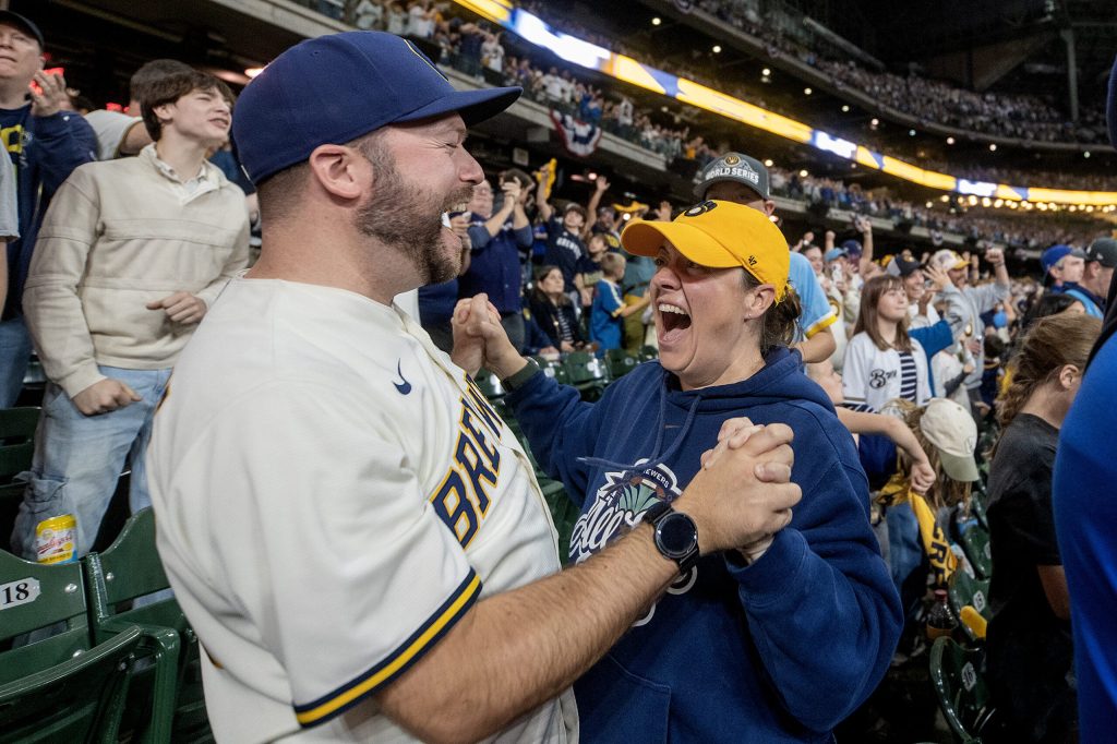 Milwaukee Brewers fans Jake and Erin DeJarlais celebrate in the fifth inning of game five of the World Series during a watch party Wednesday, Oct. 28, 2026, at American Family Field in Milwaukee, Wis. Angela Major/WPR