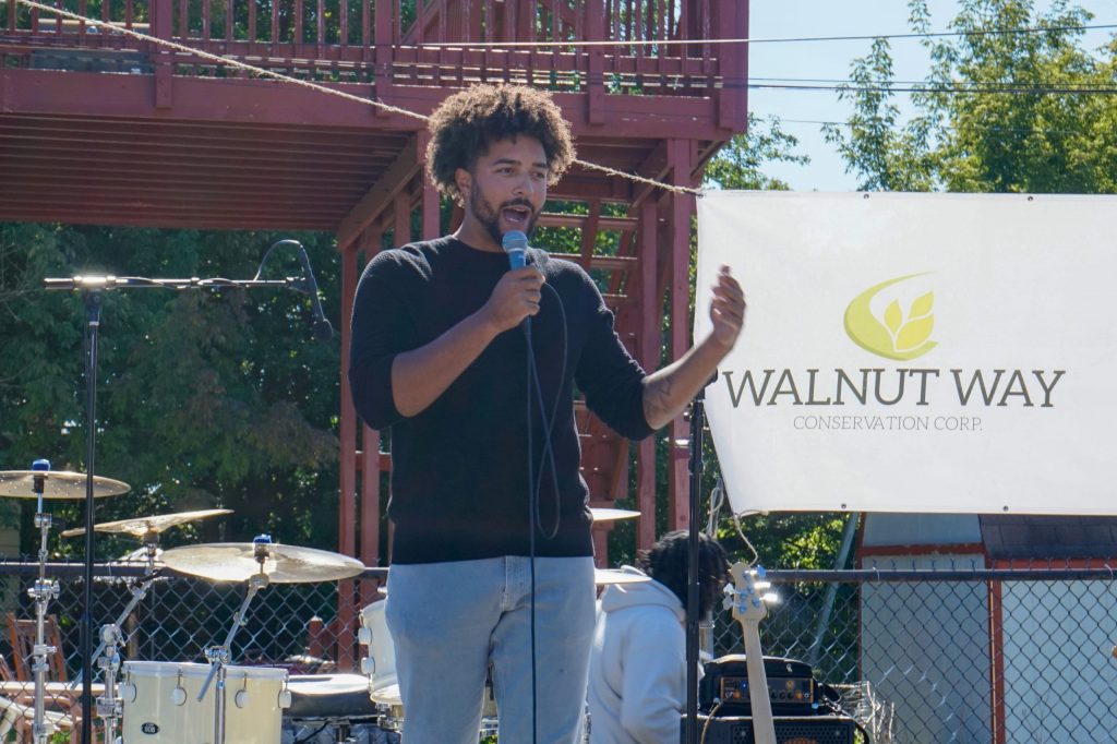 Isaiah Ness, CEO of Sun Bear Industries, talks about how owning solar infrastructure can build wealth at Harvest Day in the 2200 block of North 17th Street on Oct. 3. (Photo by Meredith Melland)