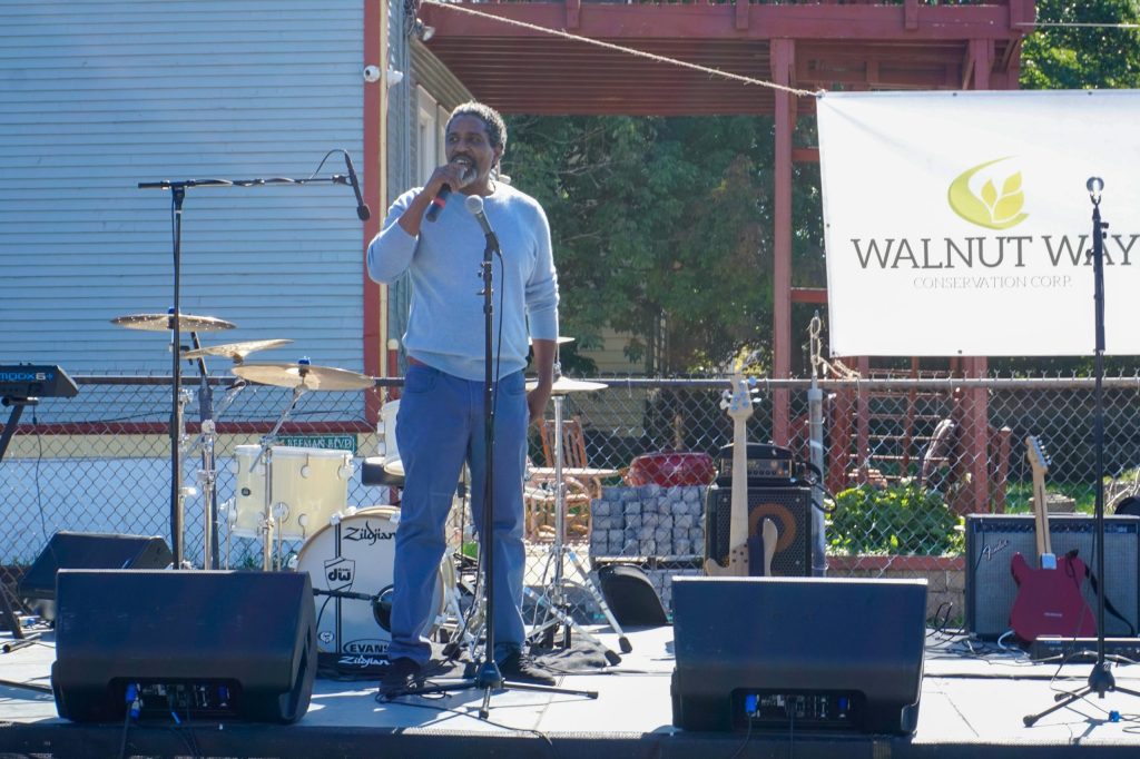 Antonio Butts, executive director of Walnut Way Conservation Corp., talks about a $1.1 million community solar grant at Harvest Day in the 2200 block of North 17th Street on Oct. 3. (Photo by Meredith Melland)