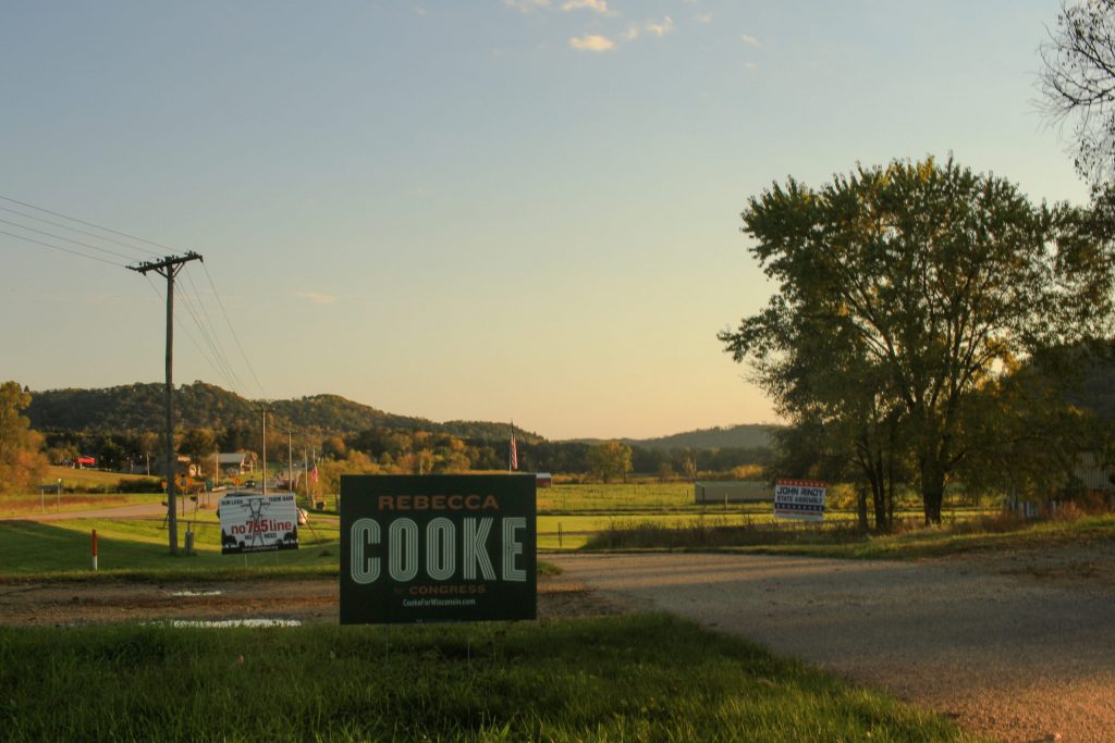 A Rebecca Cooke campaign sign sits in a front yard in Gay Mills. (Photo by Henry Redman/Wisconsin Examiner)
