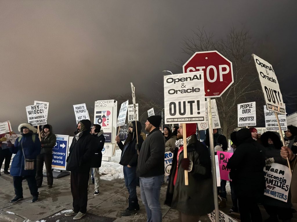 Protesters against planned data center projects in Wisconsin gather in Milwaukee on Dec. 2, 2025. Evan Casey/WPR
