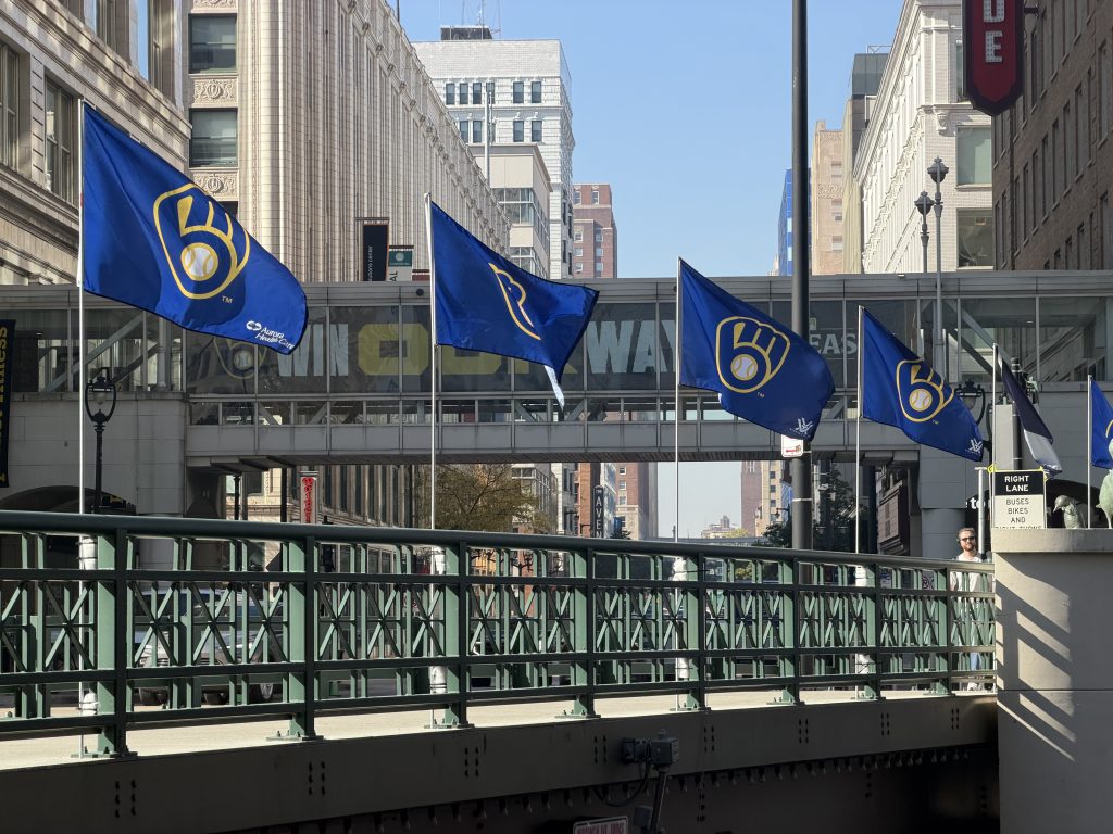 Milwaukee Brewers flags on the Wisconsin Avenue bridge. Photo by Jeramey Jannene.