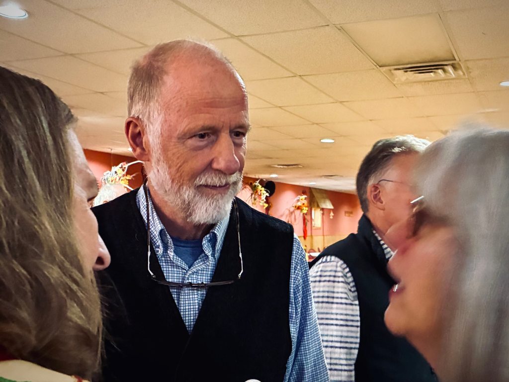 Democratic candidate Fred Clark talks with locals in Rhinelander, as he campaigns for the 7th Congressional District seat. Avery Martinez/WPR