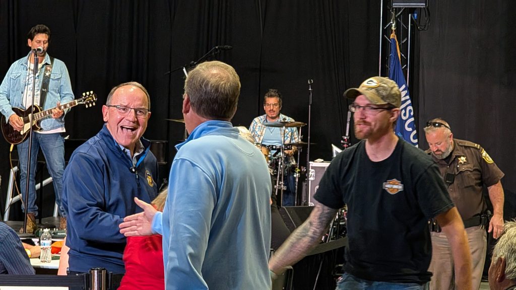 Tiffany shakes hands with attendees at the October rally. (Photo by Baylor Spears/Wisconsin Examiner)