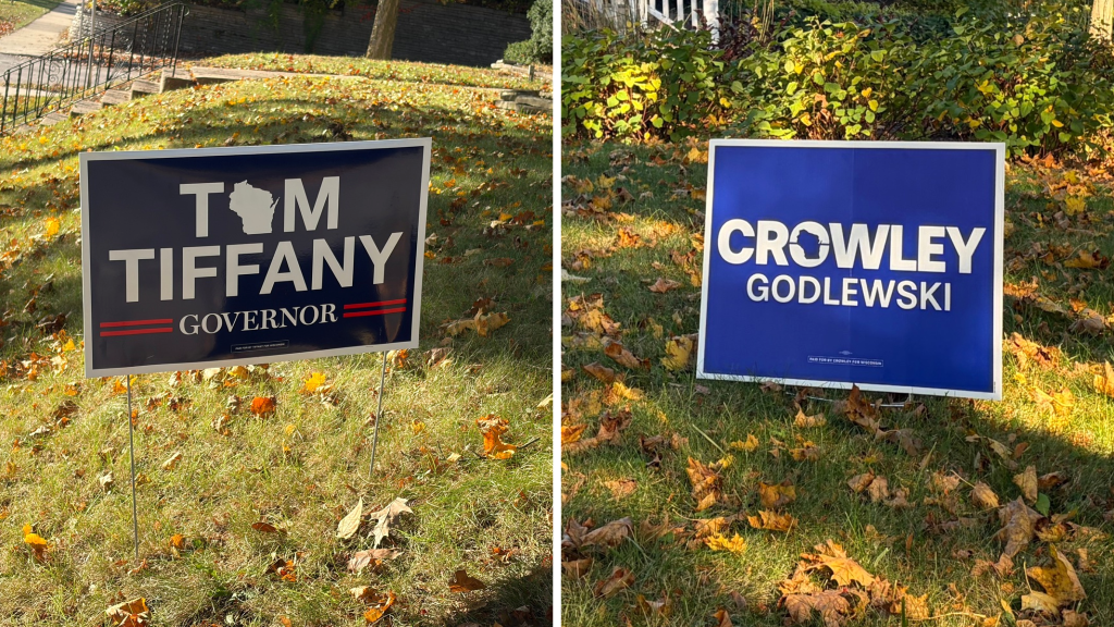 A yard sign supporting Tom Tiffany for governor, and a yard sign supporting David Crowley for governor, on the same residential street in Milwaukee, Wis., on Oct. 28. Corri Hess/WPR