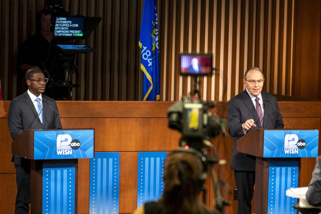 Milwaukee County Executive David Crowley. left, and U.S. Rep. Tom Tiffany appear at a gubernatorial debate at Marquette University in Milwaukee, Oct. 21, 2026. (Andy Manis for Wisconsin Watch)
