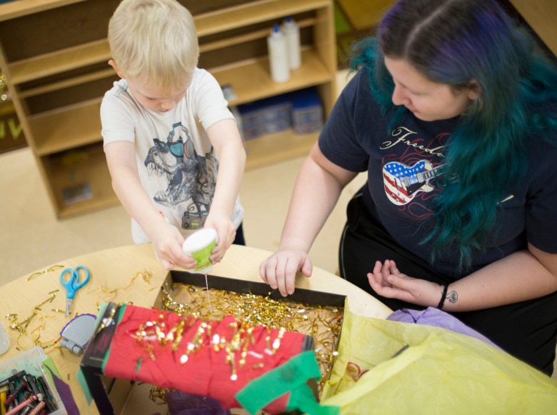A student at Madison College’s Early Learning Campus does a craft project with a teacher. Some CCAMPIS money helped technical college officials provide staff retention bonuses or create internships or apprenticeships to train new child care workers. (Courtesy of Madison College)