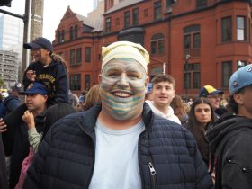 Nick Nahnsen in his Brew Crew face paint. Photo by Lauren Hafeman on Oct. 20, 2026.