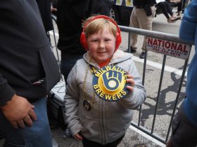 Ryker after catching a parade necklace. Photo by Lauren Hafeman on Oct. 20, 2026.
