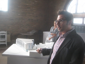 Joel Agacki points to the Model of 2202 S. Kinnickinnic Ave.
