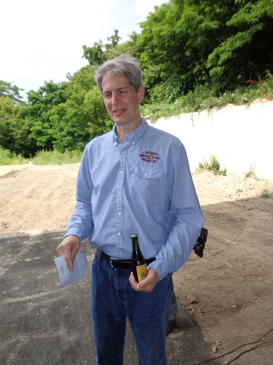 Russ Klisch holds a 15-year old bottle of Lakefront Brewery Beer Line Barley Line, produced back when his brewery was located on E. Chambers St.