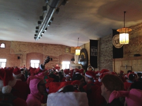 As many Santas as the fire code would allow.