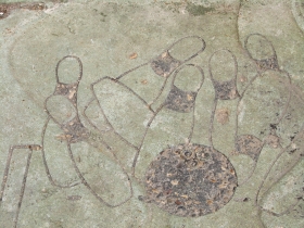 Bowling design on the sidewalk by the Coin.