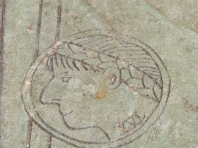 Coin design on the sidewalk.