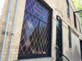 Leaded glass window on Pulaski St.