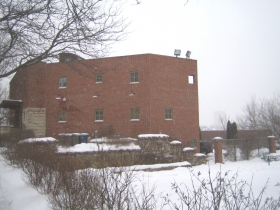 The Dixon Duplex, its foundation buttressed by substantial earthworks, rests imposingly on its lofty perch on Brewers' Hill.