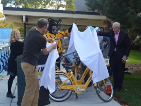 UWM chief sustainability officer Kate M. Nelson, Bublr Bikes executive director Kevin Hardman and Mayor Tom Barrett