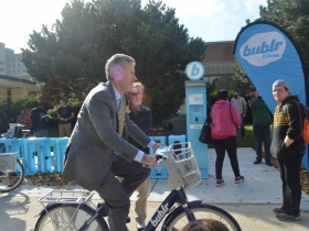 UWM Chancellor Mark Mone on a Bublr bike
