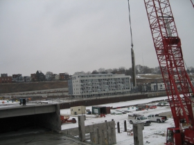 Precast concrete panel being lifted into place