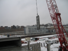 Precast concrete panel being lifted into place