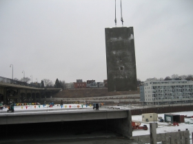 Precast concrete panel being lifted into place